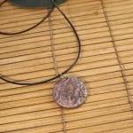 Polymer clay pendant in a c..